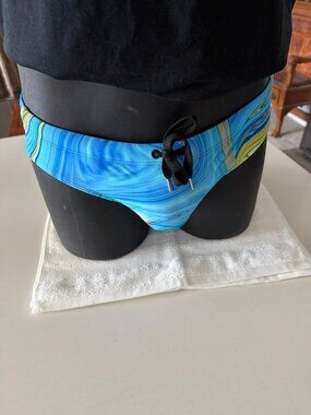 Pool Boy Northern Lights Swim Brief in blue and yellow.